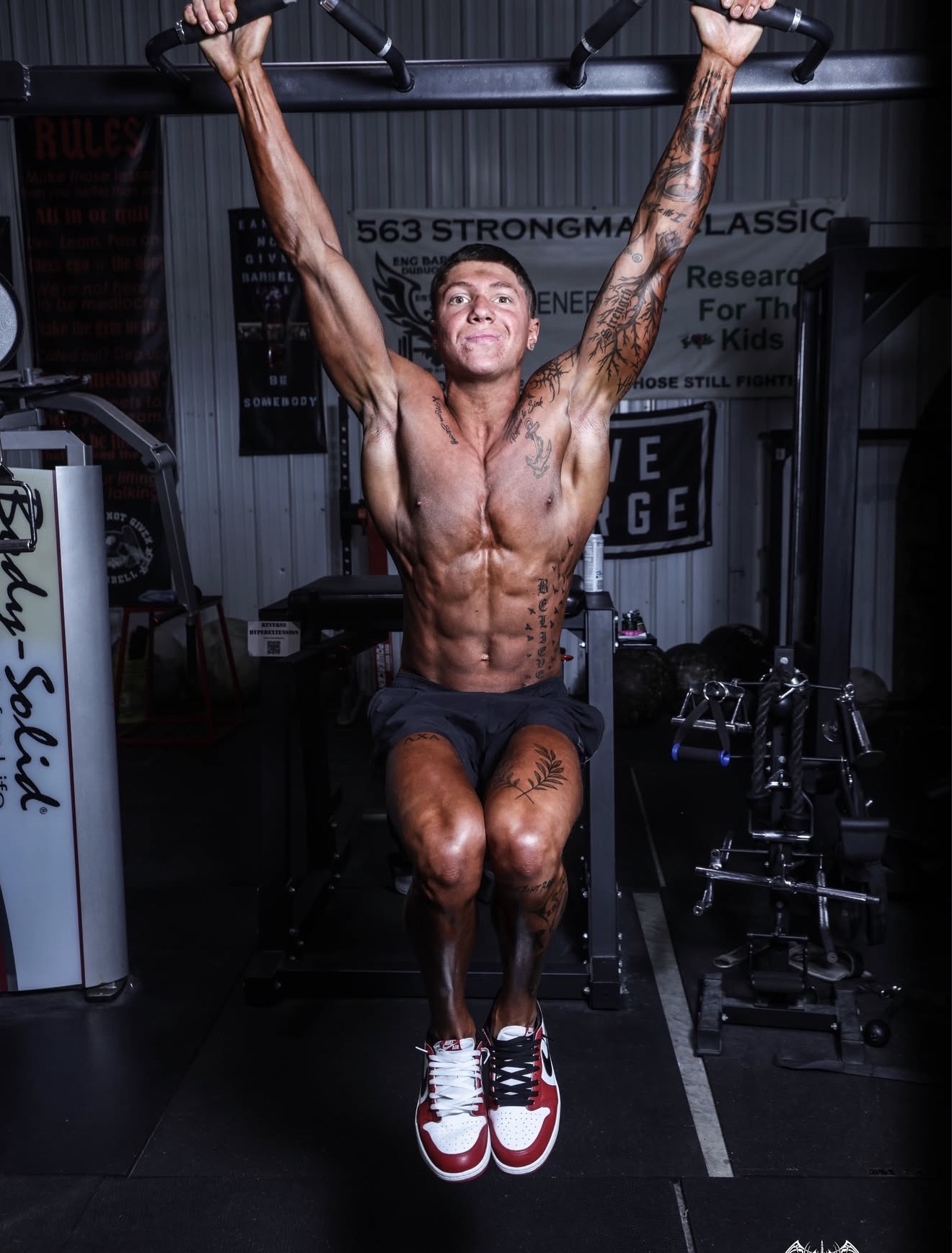 Austin Phillip training on a pull-up station